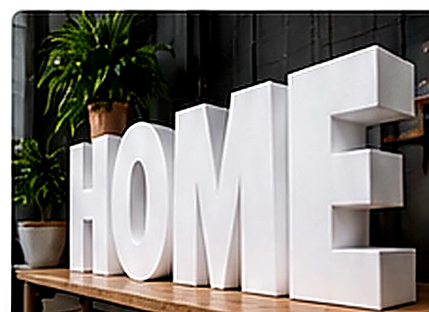 AI concept example of plain white freestanding 3D foam letters spelling HOME